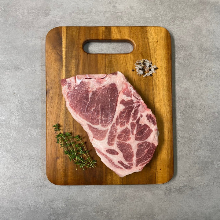 Forest pasture raised pork shoulder blade butt steak bone in bone-in